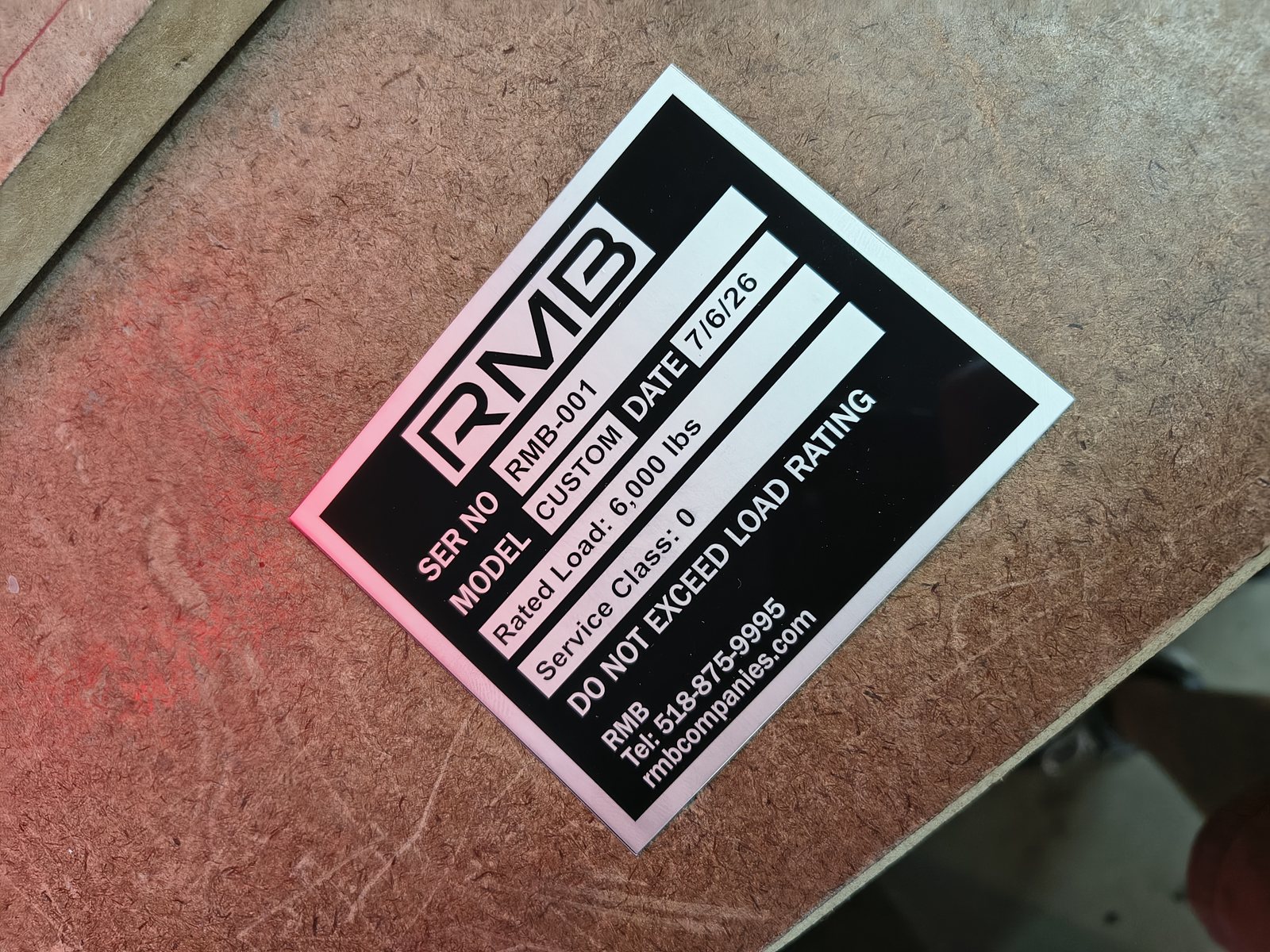 Engraved identification tag mounted on equipment