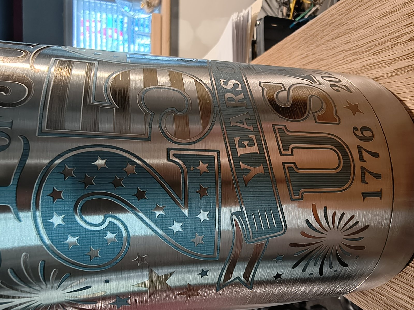 Stainless steel tumbler engraved with a detailed American flag design