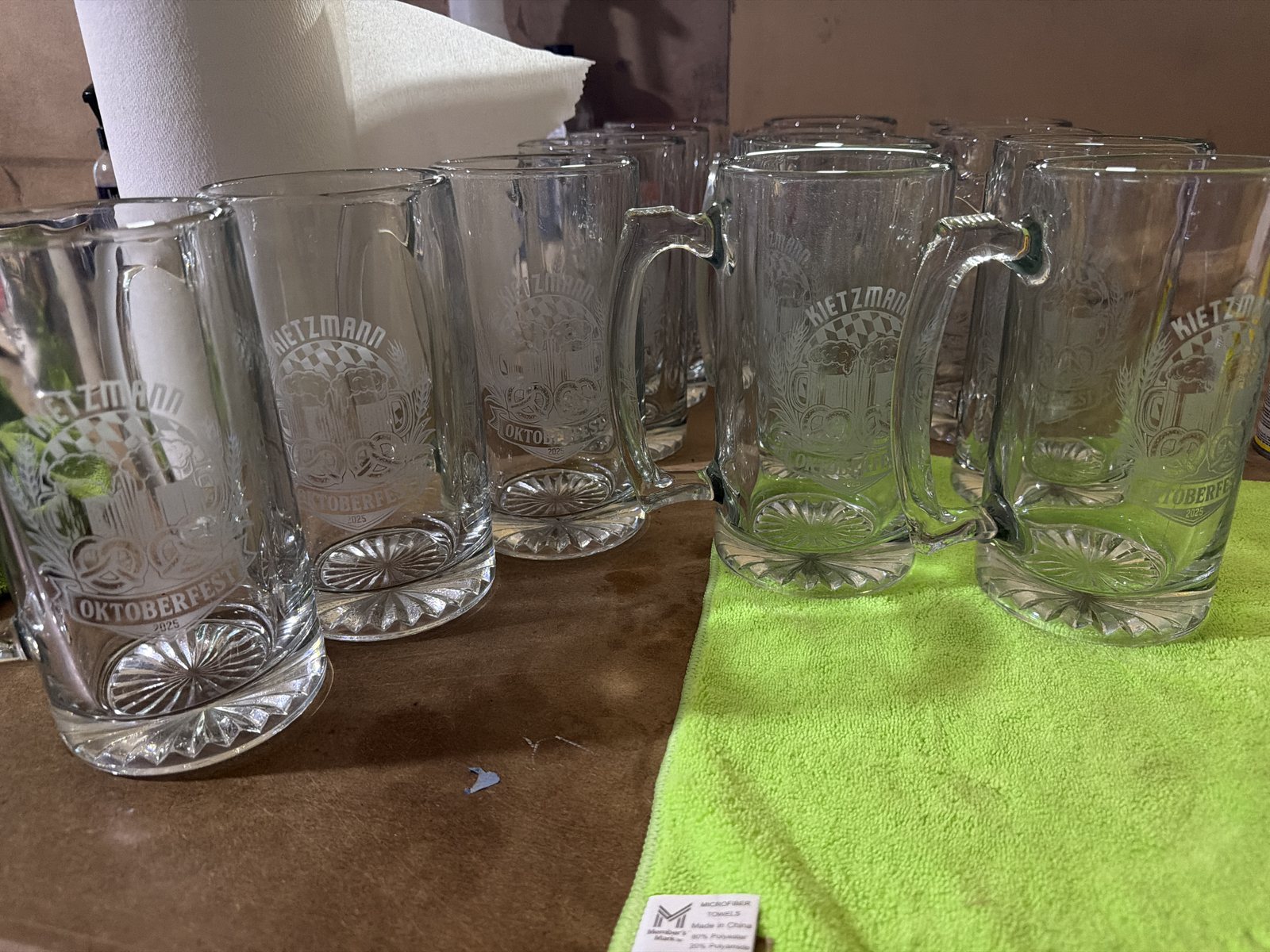 Row of clear glass beer mugs prepared for custom etching