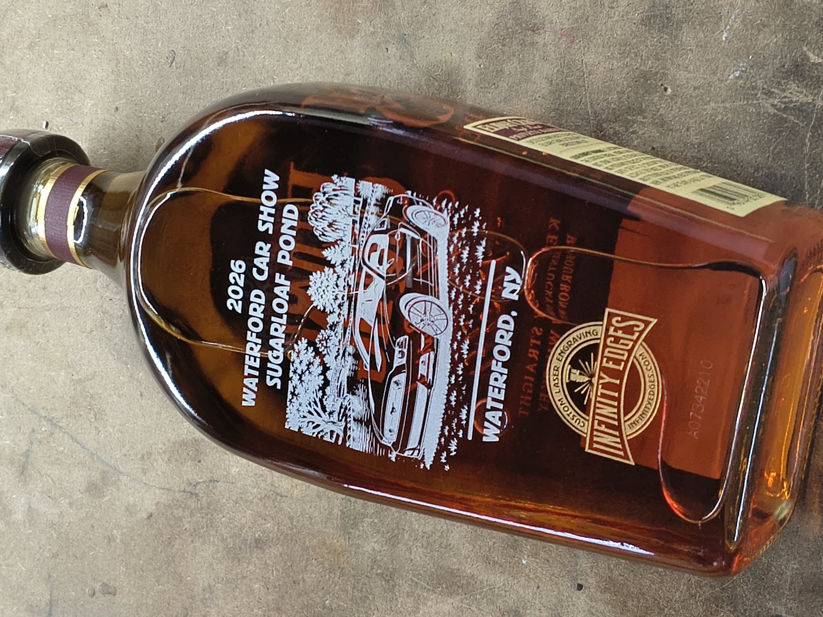 Whiskey decanter etched with a custom commemorative design